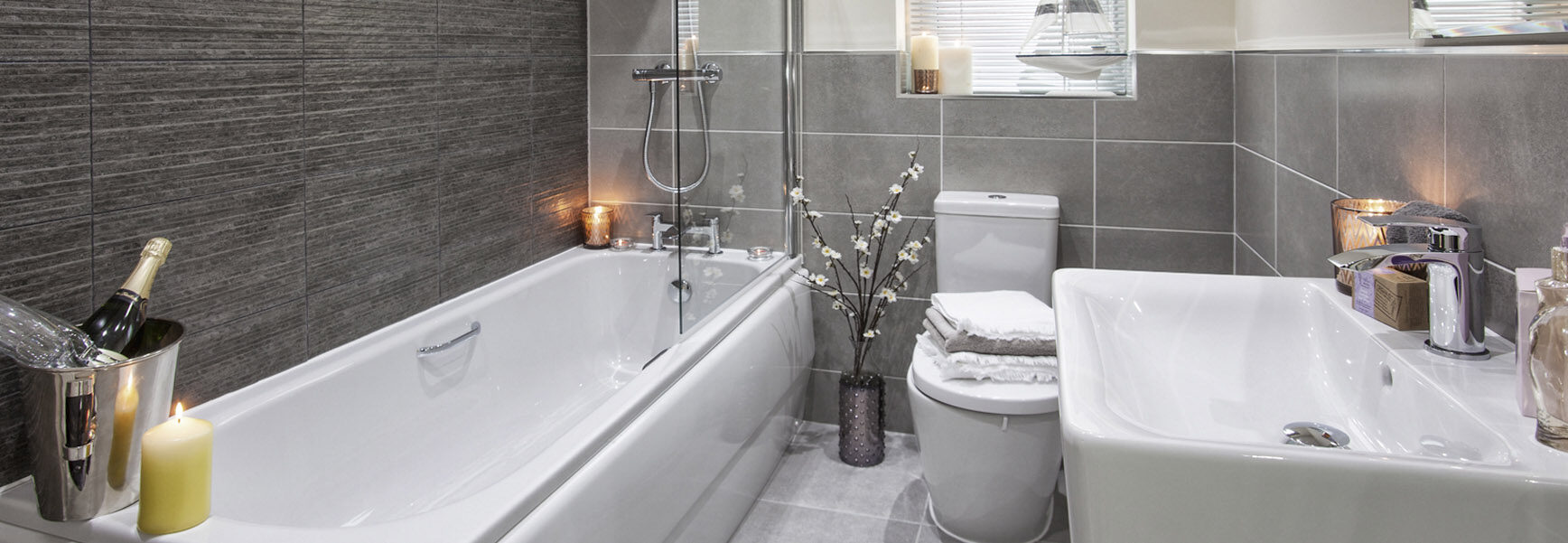 Finished new build bathroom with bath, basin and tiled walls