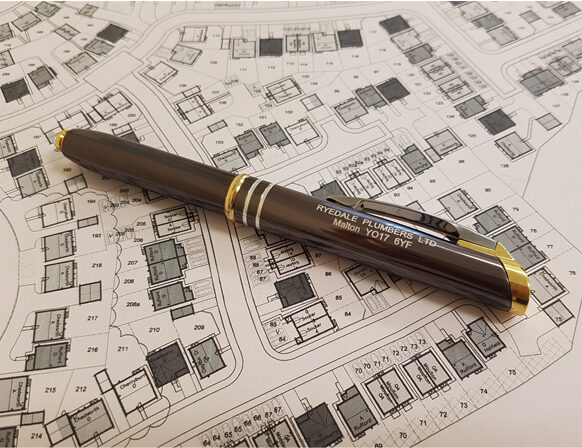 RPL branded pen resting on new build site plans